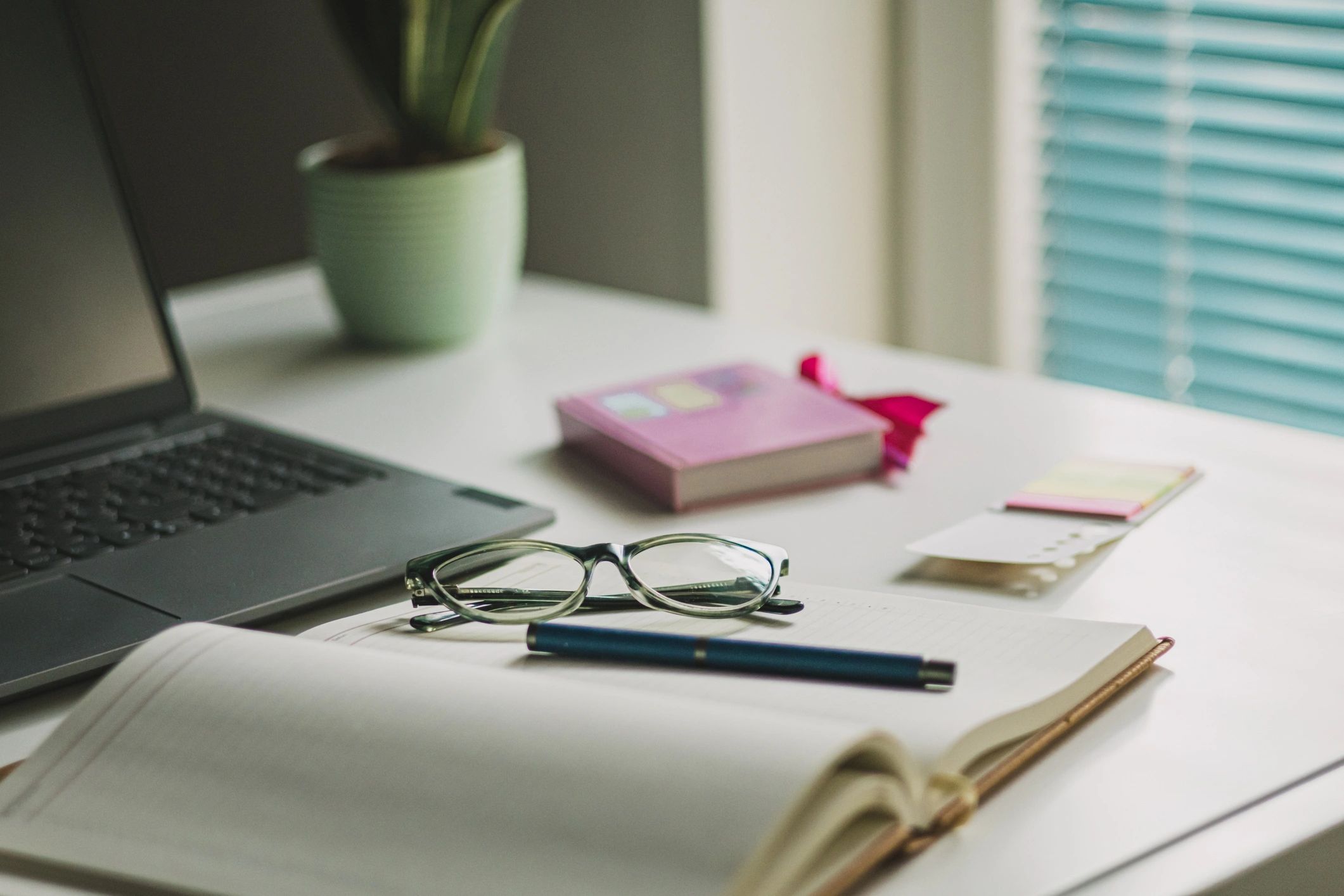 Open Bible and study materials on a desk